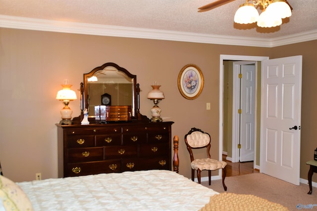 bedroom with a textured ceiling, ceiling fan, ornamental molding, and baseboards