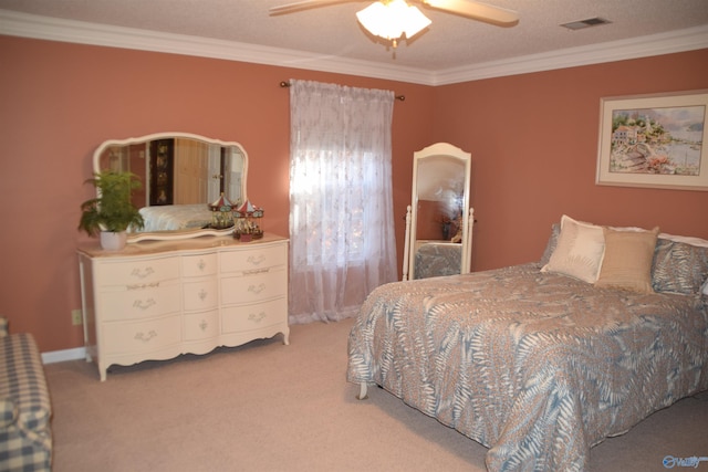 bedroom with ornamental molding, visible vents, and light carpet