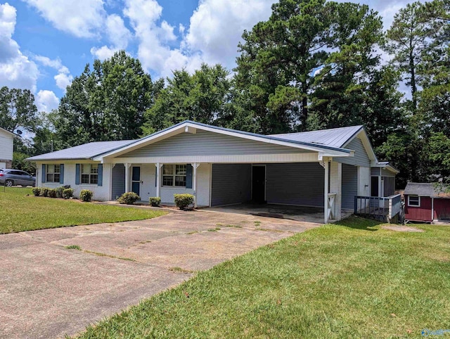 ranch-style home featuring a carport and a front lawn