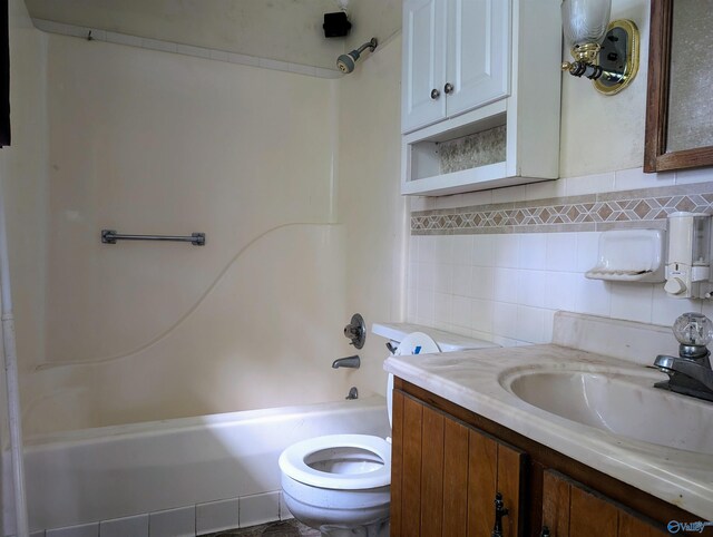 full bathroom featuring vanity, toilet, tub / shower combination, and tasteful backsplash