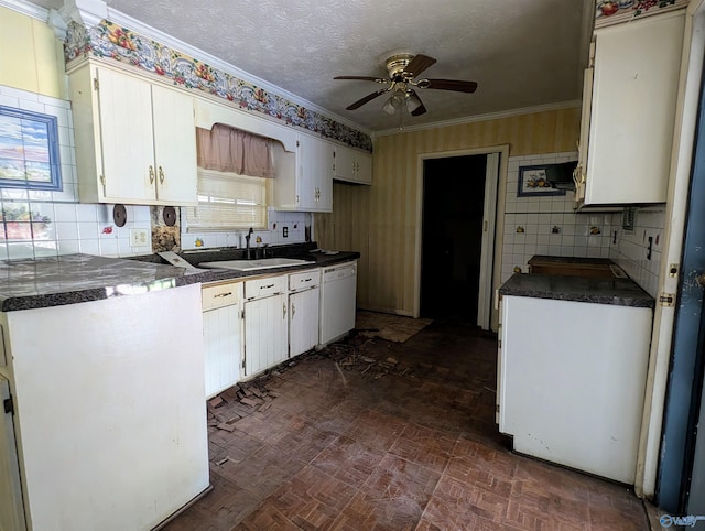 kitchen featuring white cabinets, dishwasher, sink, ceiling fan, and ornamental molding