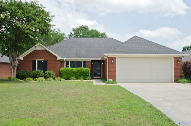 1422 Lake Crest Dr SW, Decatur, AL 35603 - view of front of property with a garage, brick siding, concrete driveway, and a front yard