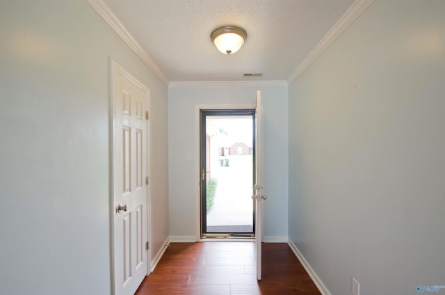 1422 Lake Crest Dr SW, Decatur, AL 35603 - doorway to outside featuring dark wood-type flooring, crown molding, baseboards, and a textured ceiling