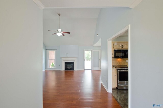 1422 Lake Crest Dr SW, Decatur, AL 35603 - unfurnished living room featuring dark wood finished floors, high vaulted ceiling, a ceiling fan, baseboards, and a glass covered fireplace