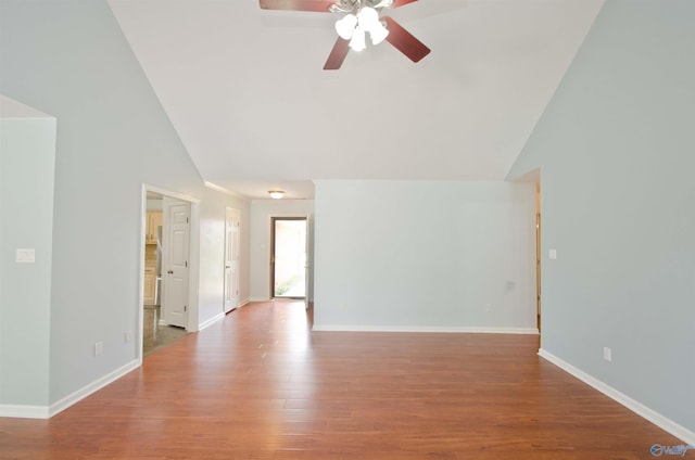 1422 Lake Crest Dr SW, Decatur, AL 35603 - unfurnished living room with lofted ceiling, a ceiling fan, wood finished floors, and baseboards