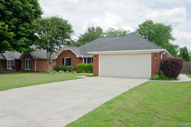 1422 Lake Crest Dr SW, Decatur, AL 35603 - ranch-style house featuring concrete driveway, a garage, brick siding, and a front yard
