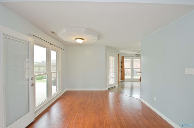 1422 Lake Crest Dr SW, Decatur, AL 35603 - spare room with hardwood / wood-style flooring, plenty of natural light, and baseboards