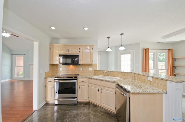 1422 Lake Crest Dr SW, Decatur, AL 35603 - kitchen with stainless steel appliances, a sink, backsplash, a peninsula, and light brown cabinets