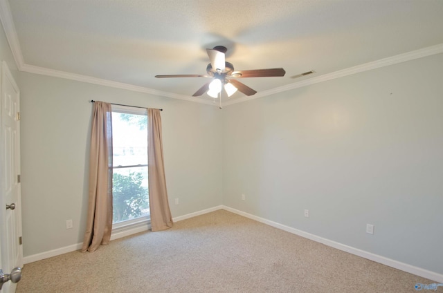 1422 Lake Crest Dr SW, Decatur, AL 35603 - spare room featuring a ceiling fan, carpet floors, baseboards, and crown molding
