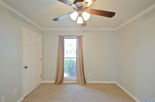 1422 Lake Crest Dr SW, Decatur, AL 35603 - spare room featuring a ceiling fan, crown molding, light carpet, and baseboards