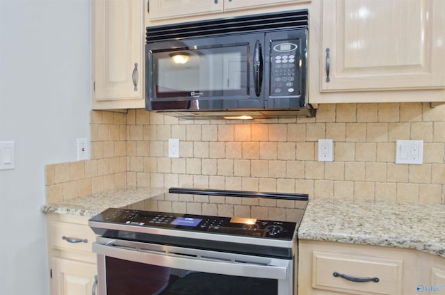 1422 Lake Crest Dr SW, Decatur, AL 35603 - kitchen featuring stainless steel electric range, black microwave, decorative backsplash, and light stone countertops