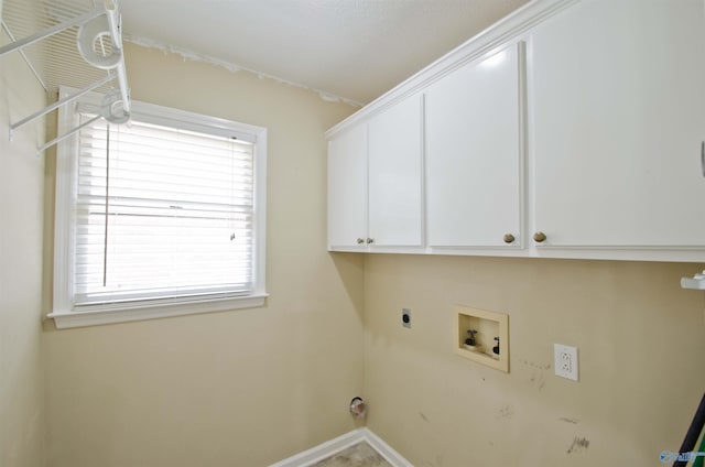 1422 Lake Crest Dr SW, Decatur, AL 35603 - laundry area featuring cabinet space, plenty of natural light, hookup for a washing machine, and electric dryer hookup