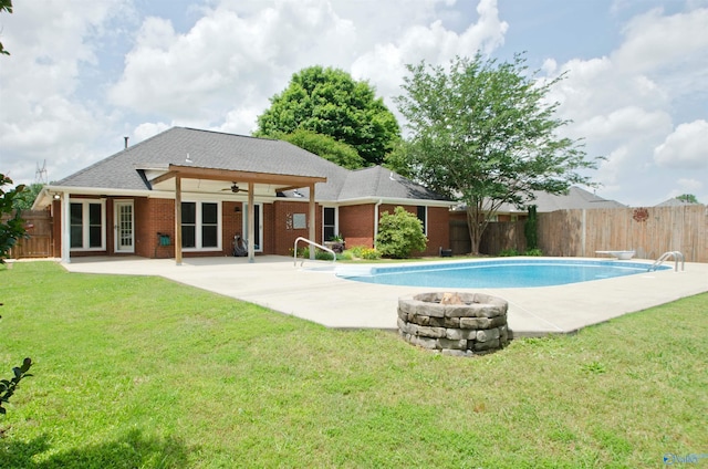 1422 Lake Crest Dr SW, Decatur, AL 35603 - view of swimming pool featuring ceiling fan, an outdoor fire pit, and a patio