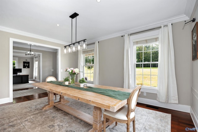 1211 SW Rountree Pl, Madison, AL 35756 - dining area with crown molding, baseboards, and wood finished floors