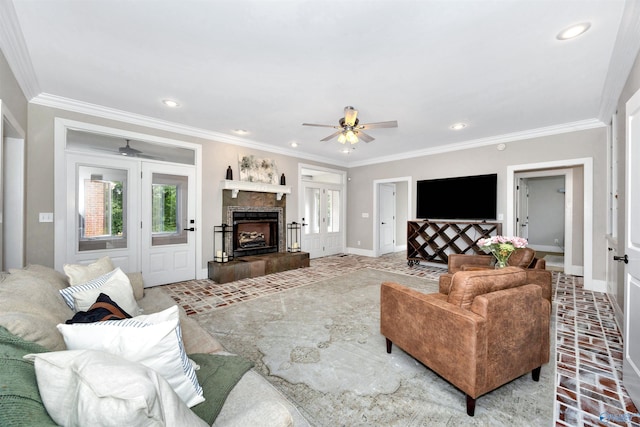 1211 SW Rountree Pl, Madison, AL 35756 - living area featuring a ceiling fan, baseboards, crown molding, a tile fireplace, and recessed lighting