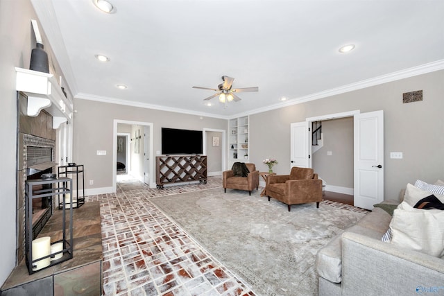 1211 SW Rountree Pl, Madison, AL 35756 - living room with baseboards, a ceiling fan, crown molding, built in shelves, and recessed lighting
