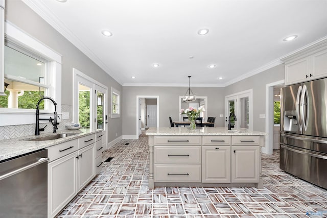 1211 SW Rountree Pl, Madison, AL 35756 - kitchen featuring appliances with stainless steel finishes, brick floors, a sink, baseboards, and recessed lighting