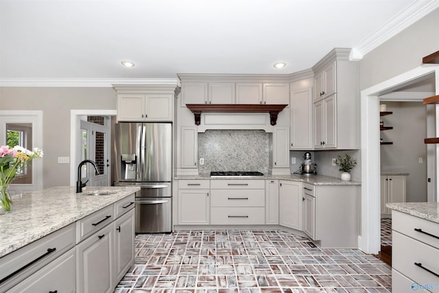 1211 SW Rountree Pl, Madison, AL 35756 - kitchen featuring stainless steel fridge, a sink, brick patterned flooring, gas cooktop, and ornamental molding