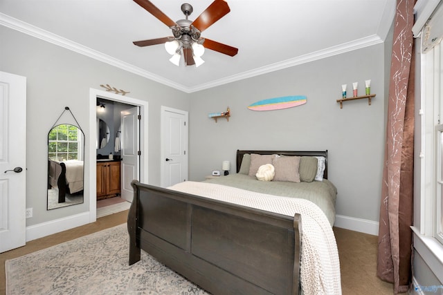 1211 SW Rountree Pl, Madison, AL 35756 - bedroom featuring crown molding, baseboards, light carpet, a ceiling fan, and ensuite bathroom