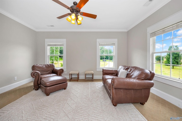 1211 SW Rountree Pl, Madison, AL 35756 - living room featuring healthy amount of natural light, ornamental molding, light carpet, baseboards, and a ceiling fan