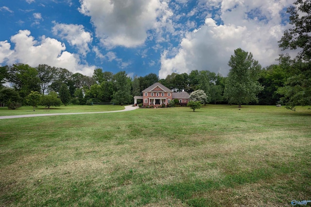 1211 SW Rountree Pl, Madison, AL 35756 - view of grassy yard with view of wooded area