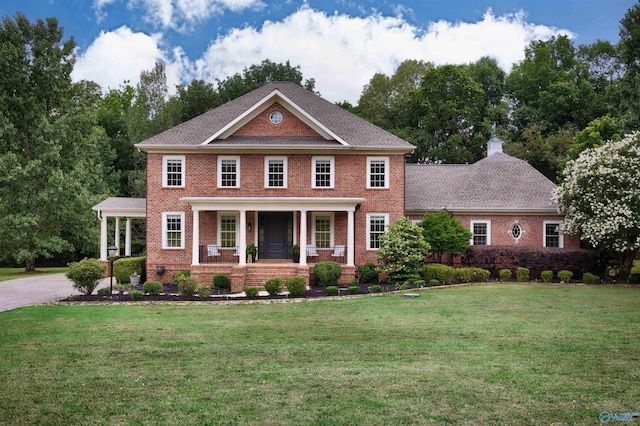 1211 SW Rountree Pl, Madison, AL 35756 - colonial inspired home with covered porch, brick siding, and a front yard
