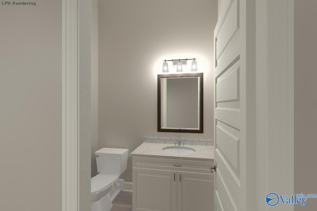 bathroom with vanity and toilet