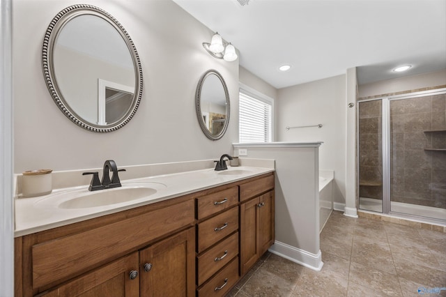 119 Saint Clair Ln, Huntsville, AL 35811 - full bathroom featuring double vanity, a bath, a stall shower, baseboards, and recessed lighting