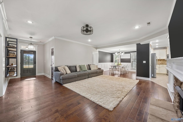 119 Saint Clair Ln, Huntsville, AL 35811 - living room with dark wood-style floors, recessed lighting, a chandelier, a fireplace, and baseboards
