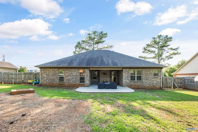 119 Saint Clair Ln, Huntsville, AL 35811 - rear view of property featuring a patio area, brick siding, and a shingled roof