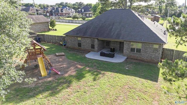 119 Saint Clair Ln, Huntsville, AL 35811 - rear view of property with brick siding, a playground, a patio, and roof with shingles