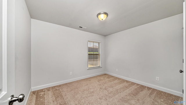 empty room with light colored carpet