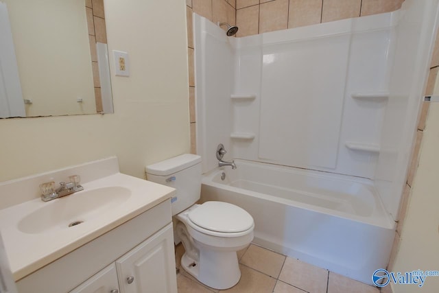 full bathroom with vanity, tiled shower / bath combo, toilet, and tile patterned floors