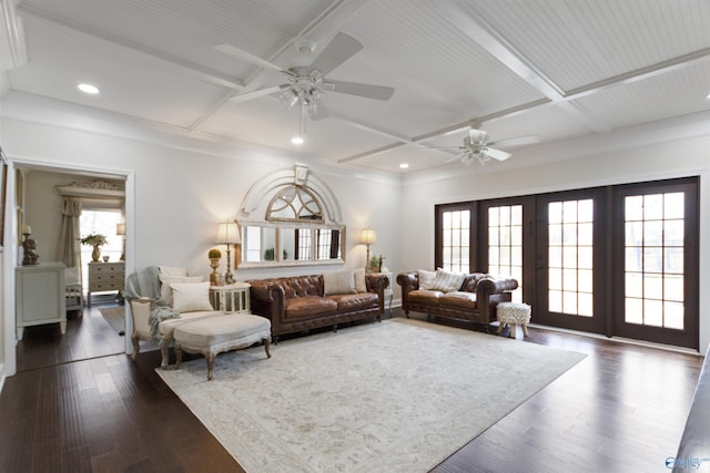 living room with coffered ceiling, beam ceiling, dark hardwood / wood-style flooring, and ceiling fan