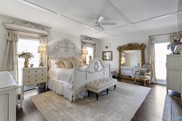 bedroom featuring crown molding, coffered ceiling, and dark hardwood / wood-style flooring