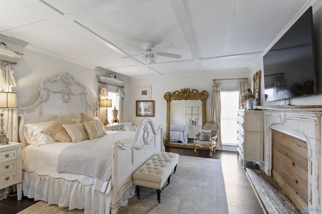 bedroom with ceiling fan, coffered ceiling, ornamental molding, dark hardwood / wood-style flooring, and beamed ceiling