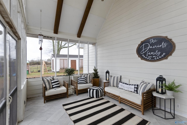 sunroom with vaulted ceiling with beams