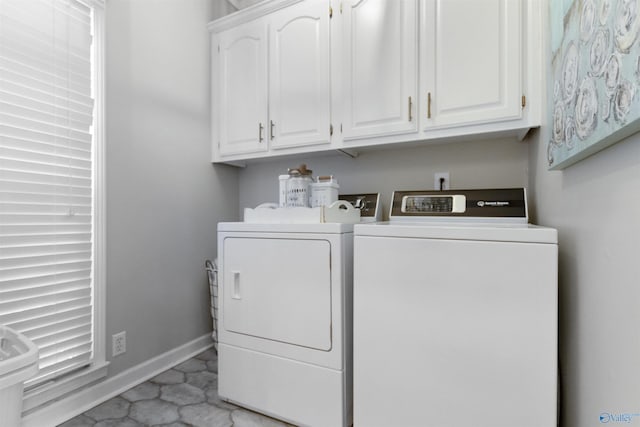 laundry area featuring cabinets and washer and dryer