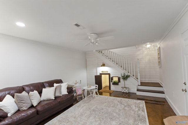 living room featuring crown molding, ceiling fan, and dark hardwood / wood-style floors