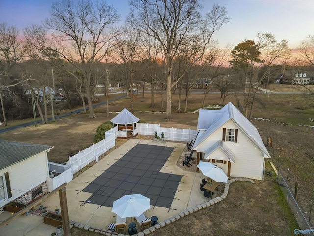 patio terrace at dusk with a gazebo