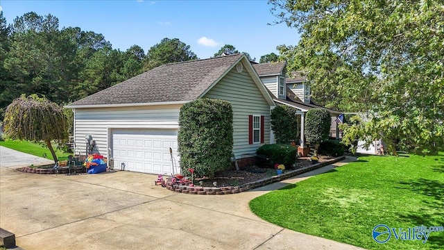 view of property exterior featuring a yard and a garage