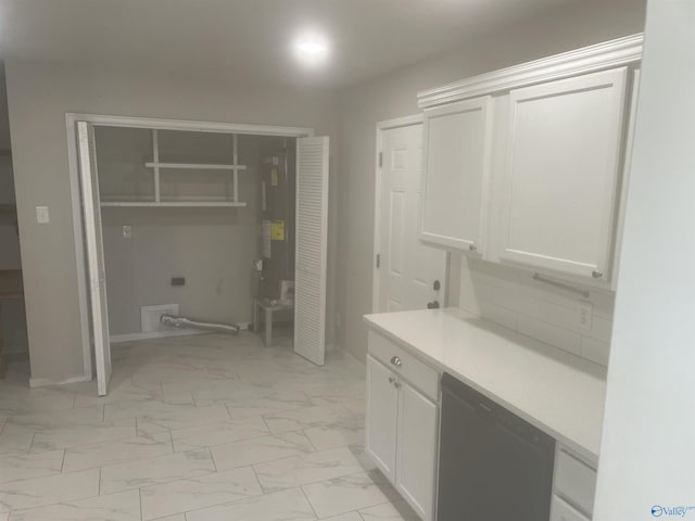 bathroom featuring marble finish floor and baseboards