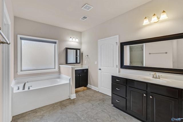 full bathroom with a garden tub, two vanities, visible vents, and a sink