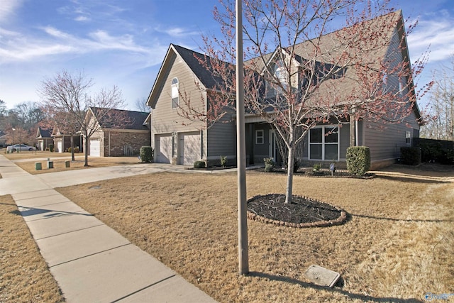 view of front of house with concrete driveway and an attached garage