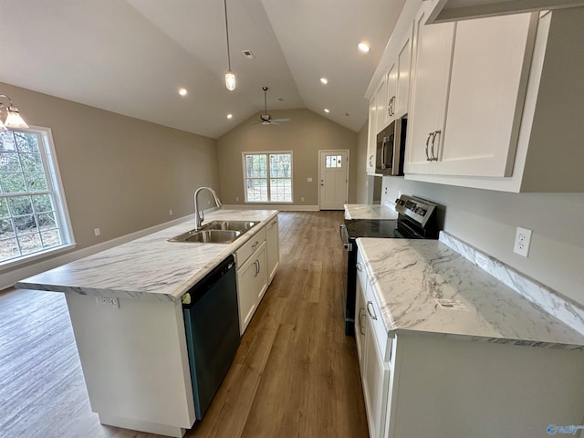 kitchen with pendant lighting, dishwasher, a kitchen island with sink, white cabinets, and range with electric cooktop