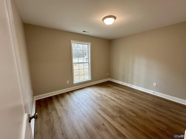 spare room featuring hardwood / wood-style flooring