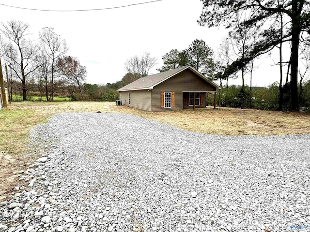 view of home's exterior with cooling unit