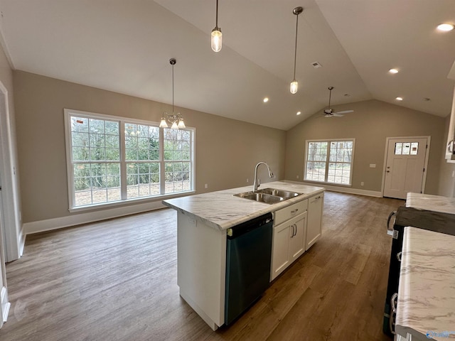 kitchen with light stone counters, sink, a center island with sink, dishwasher, and white cabinetry