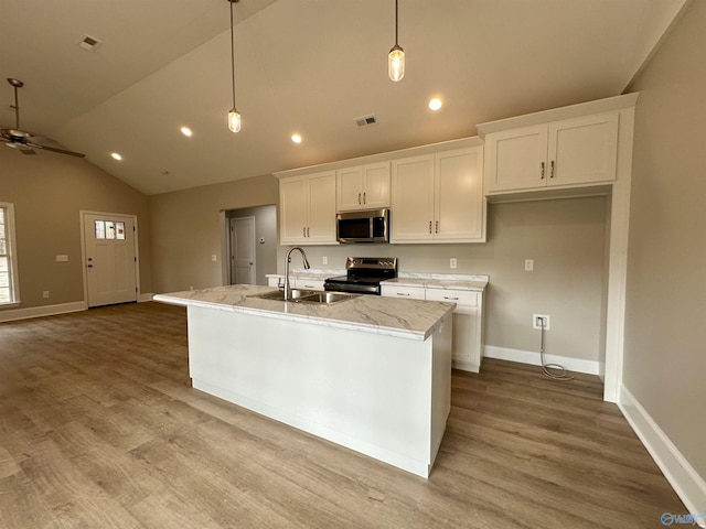 kitchen with pendant lighting, a kitchen island with sink, sink, ceiling fan, and stainless steel appliances