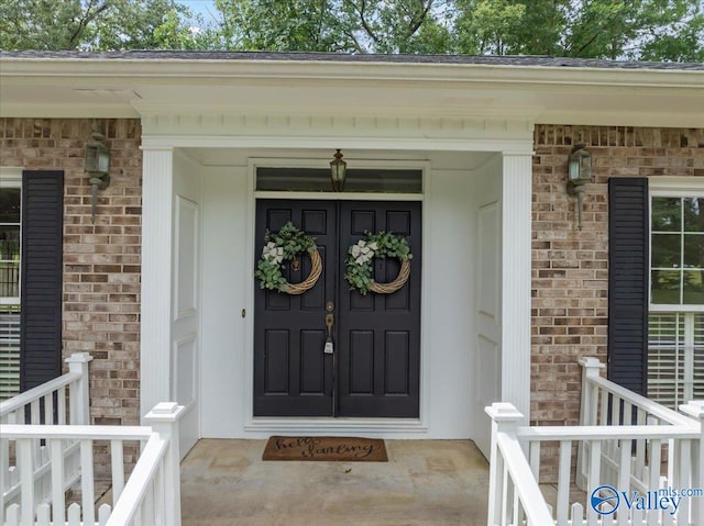 doorway to property featuring covered porch